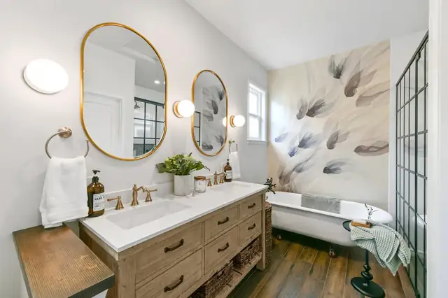 Oakland bathroom remodel with a painted wall mural, wood vanity, brass oval mirrors and a clawfoot tub