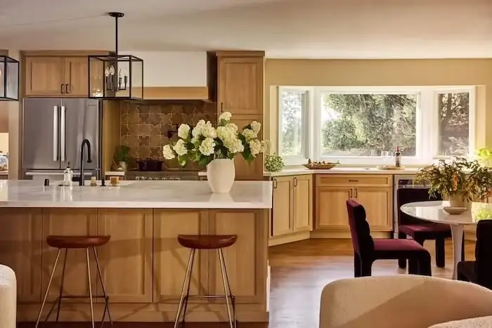 Happy Hollow kitchen remodel in Lafayette with wood cabinets, a lantern pendant, an island with stools and a patterned backsplash